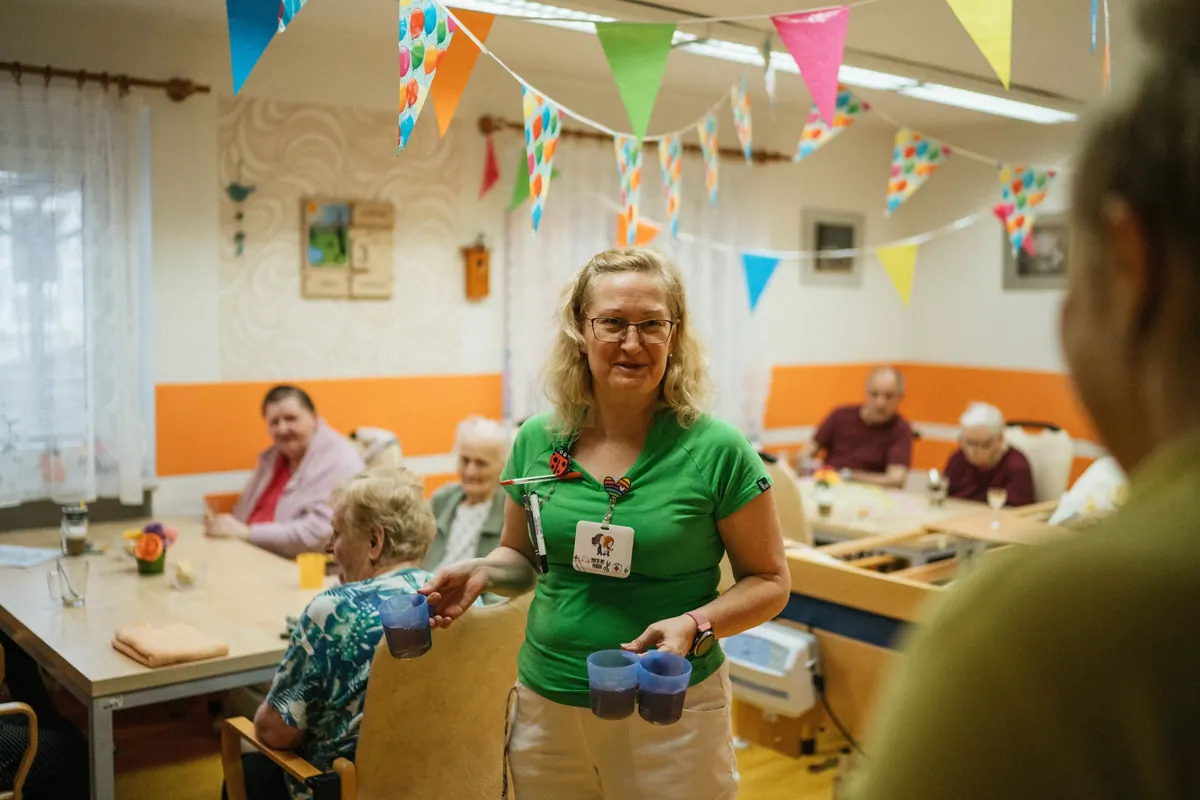 Senior residents in the dining room of an assisted living community